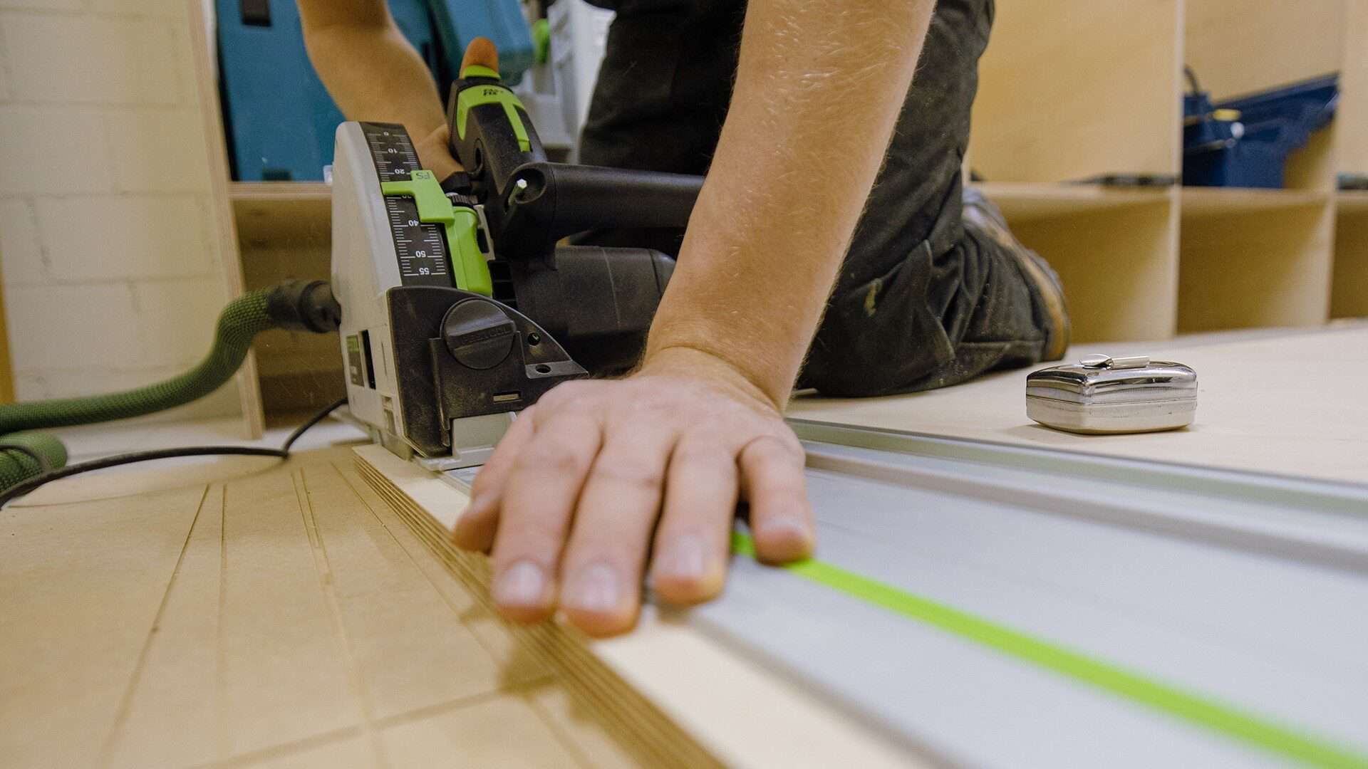 man-using-electric-saw